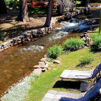 Lawn Chairs next to River at Cucharas River Bed and Breakfast
